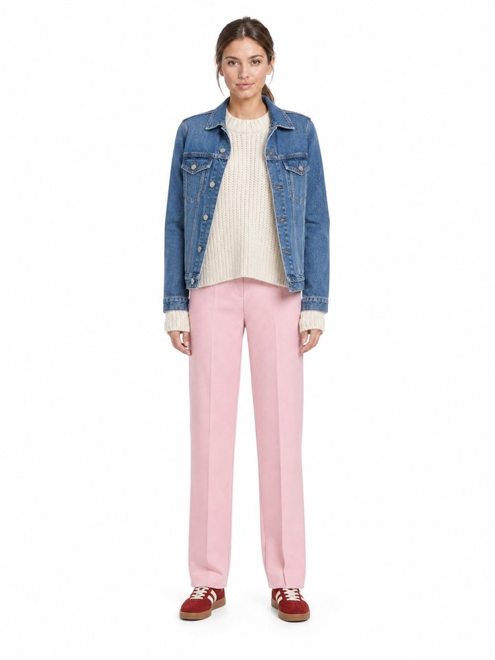 Avatar wearing a denim jacket, cream knit and pink trousers.